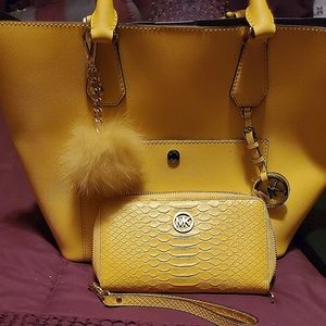 Yellow Michael Kors purse with a Yellow wristlet